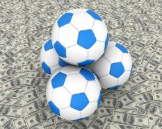 Four footballs with dollar background stock photo