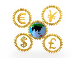 Four gears with currency symbols with globe stock photo