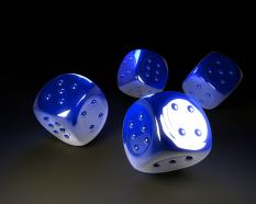 Four glossy blue color dices stock photo