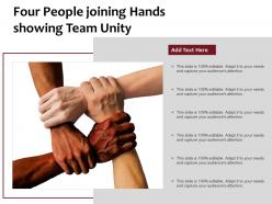 Four People Joining Hands Showing Team Unity