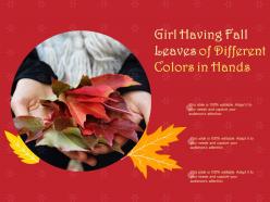 Girl having fall leaves of different colors in hands