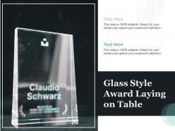 Glass style award laying on table