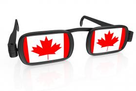 Glasses with flag of canada stock photo