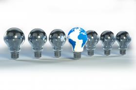 Global innovation symbol with a glowing light bulb stock photo