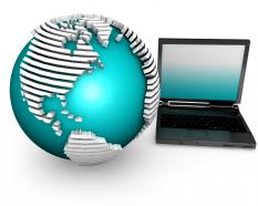 Globe with laptop depicting internet for global connectivity in business stock photo