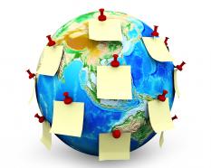 Globe with multiple stick on notes stock photo