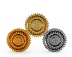 Gold bronze and silver gears showing concept of winners awards stock photo