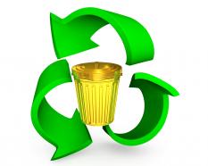 Golden bin with recycle symbol stock photo