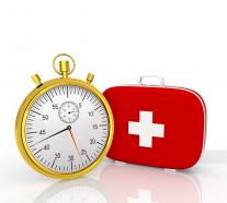 Golden clock with first aid box stock photo