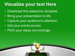 Golden trophy on green carpet winner powerpoint templates ppt themes and graphics 0313