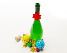 Green bottle with colorful decorative balls stock photo