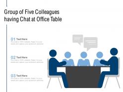 Group of five colleagues having chat at office table