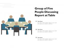 Group of five people discussing report at table