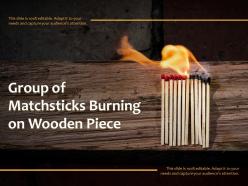 Group of matchsticks burning on wooden piece