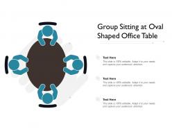 Group sitting at oval shaped office table