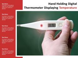 Hand holding digital thermometer displaying temperature