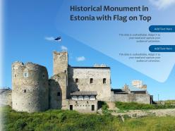 Historical monument in estonia with flag on top