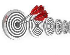 Hitting a target on a board showing focus on goal stock photo