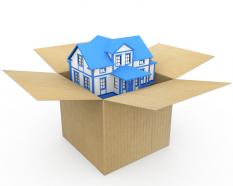Home In Carton On White Background Stock Photo
