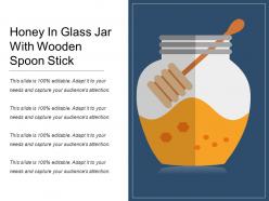 Honey in glass jar with wooden spoon stick