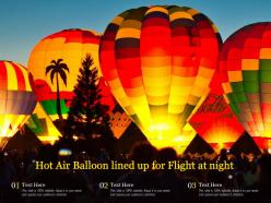 Hot air balloon lined up for flight at night