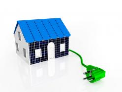 House With Green Plug Solar Energy Concept Stock Photo