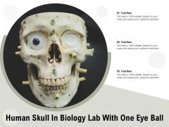 Human skull in biology lab with one eye ball