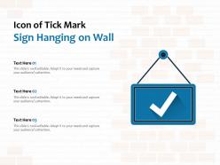 Icon of tick mark sign hanging on wall