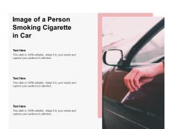 Image of a person smoking cigarette in car