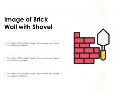 Image of brick wall with shovel