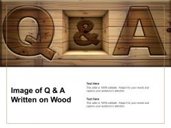 Image of q and a written on wood