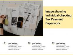Image showing individual checking tax payment paperwork