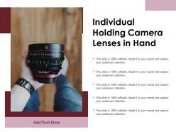 Individual holding camera lenses in hand