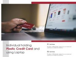 Individual holding plastic credit card and using laptop
