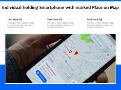 Individual holding smartphone with marked place on map