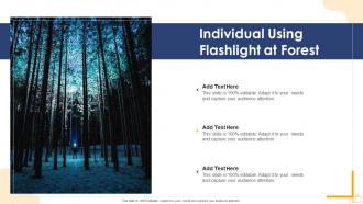 Individual using flashlight at forest