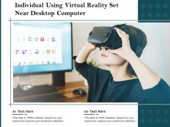 Individual Using Virtual Reality Set Near Desktop Computer