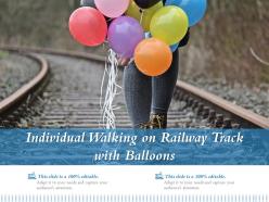 Individual Walking On Railway Track With Balloons