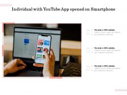 Individual with youtube app opened on smartphone