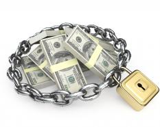 Iron chain and lock surrounding dollars graphic stock photo