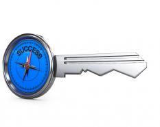 Key with compass head pointing to success stock photo