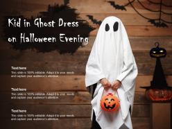 Kid in ghost dress on halloween evening
