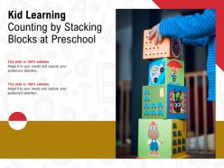 Kid learning counting by stacking blocks at preschool