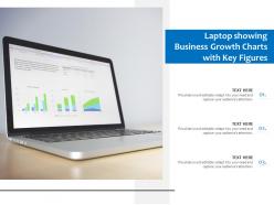 Laptop showing business growth charts with key figures
