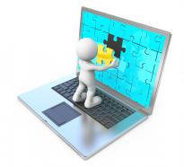 Laptop with puzzle screen and 3d man stock photo