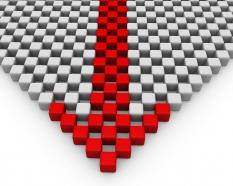 Leading arrow designed with red and white cubes stock photo