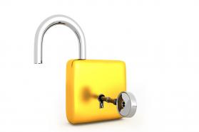Lock with key in golden color stock photo