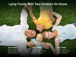 Lying family with two children on grass