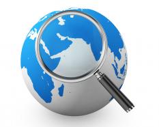 Magnifier with globe stock photo