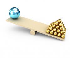 Maintain balance with team concept with golden and blue balls stock photo